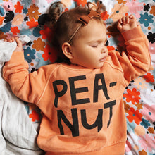Baby Peanut Sweater by Castle. Little girl sleeping in Sweet Pea range by Castle