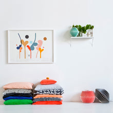 Two stacks of Castle Cushions in White Room with Large Painting by Rachel Castle and Shelf With Pots by Castle