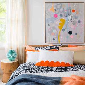 Peach Velvet Pillowcase Styled with Colourful Assortment of Pillowcases in Well Lit Room by Castle