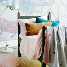Butterscotch Velvet Lumbar Cushion by Castle. Cosy single bed setup